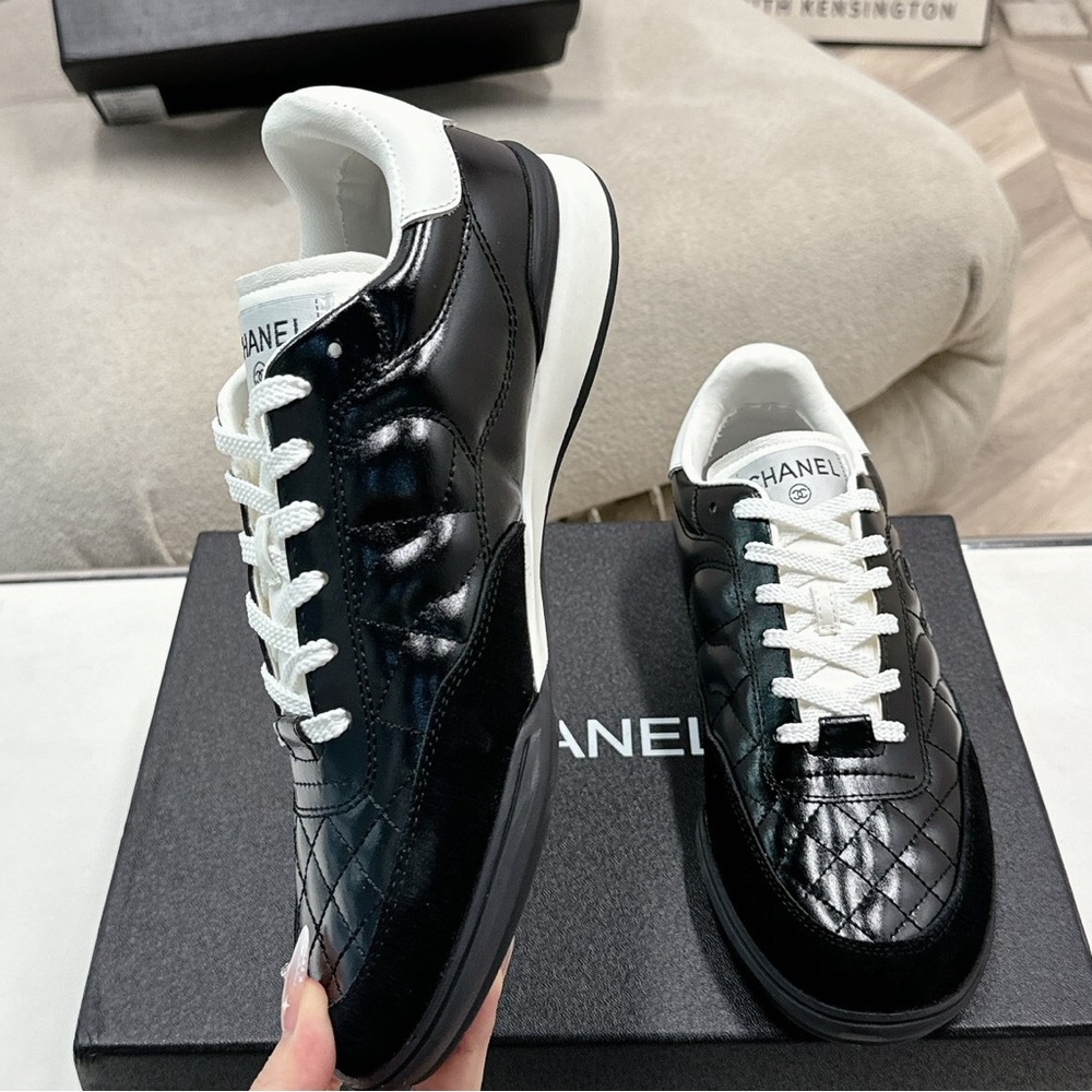 Women's Chanel Black Quilted Patent Leather White Lace-Up Sneakers - Picture 3 of 7